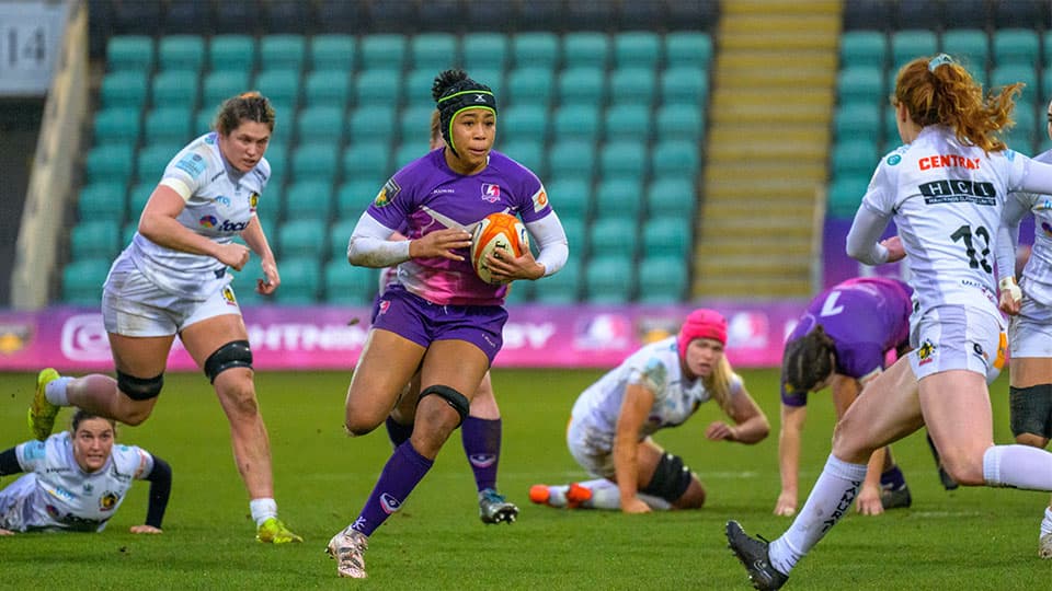 Sadia playing rugby in her Loughborough Lightning kit.